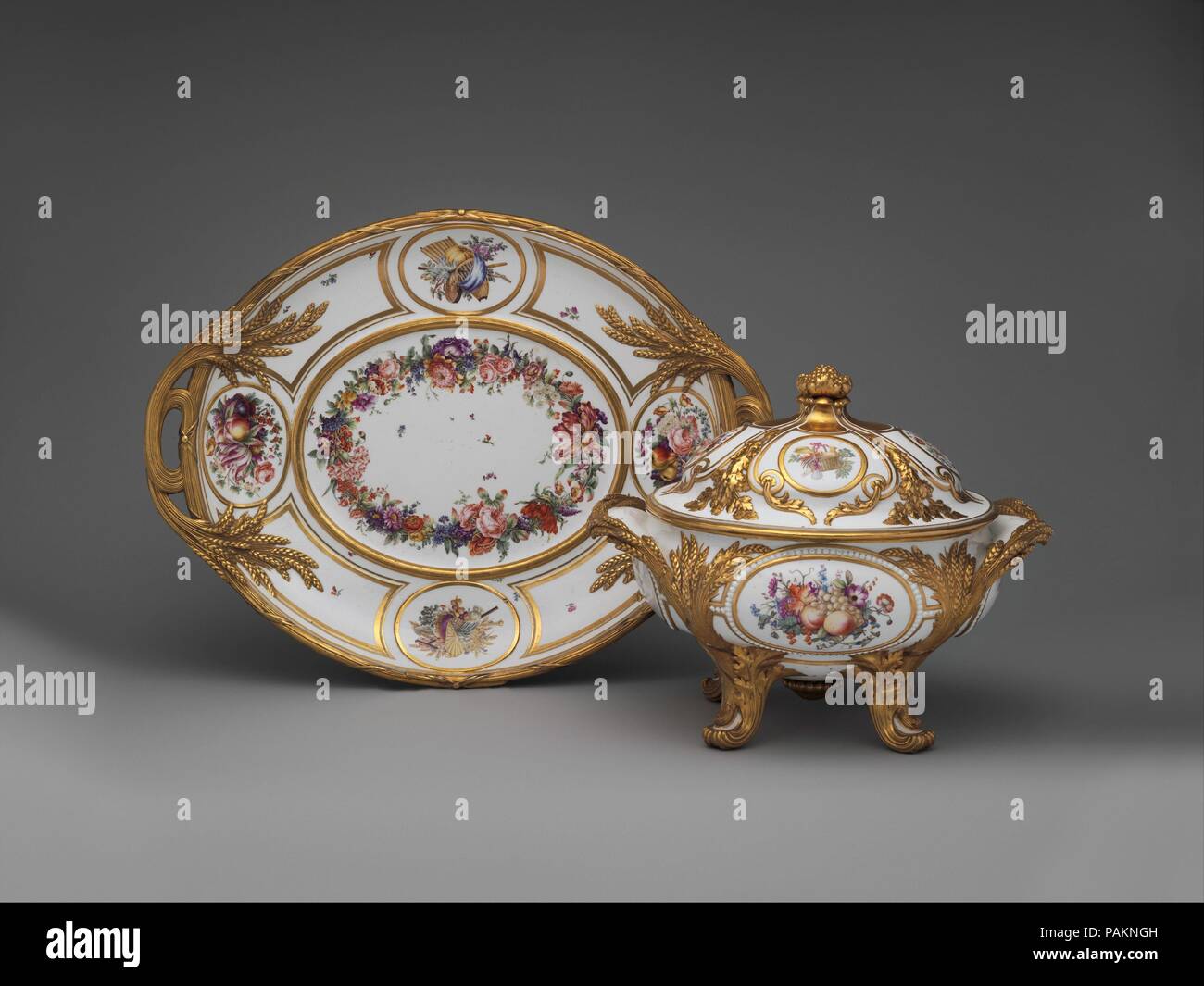 Stand. Culture: French, Sèvres. Decorator: François Antoine Pfeiffer (French, active 1771-1800); Nicolas Sinsson (French, active 1773-1795). Dimensions: Overall (confirmed): 3 × 24 1/4 × 18 1/2 in. (7.6 × 61.6 × 47 cm). Factory: Sèvres Manufactory (French, 1740-present). Maker: Gilded by Henri-François Vincent (active 1753-1806). Date: ca. 1777-85. Museum: Metropolitan Museum of Art, New York, USA. Stock Photo