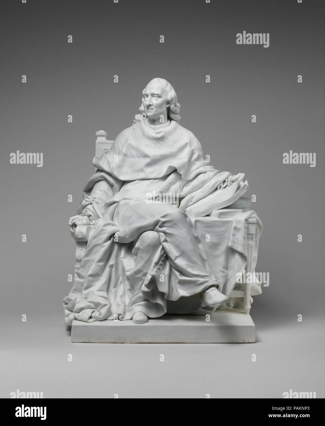 Charles de Secondat, Baron de Montesquieu (1689-1755). Culture: French, Sèvres. Dimensions: Overall (confirmed): 14 x 11 1/4 x 10 5/16 in. (35.6 x 28.6 x 26.2 cm); Base: 9 9/16 x 8 3/4 in. (24.3 x 22.2 cm). Manufactory: Sèvres Manufactory (French, 1740-present). Modeler: After a model by Clodion (Claude Michel) (French, Nancy 1738-1814 Paris). Date: ca. 1784.  This portrait of the writer-philosopher Montesquieu is a reduction of a full-size marble executed as one of a series of statues of the Great Men of France commissioned on behalf of Louis XVI from Clodion, Houdon, Pajou, and other sculpto Stock Photo