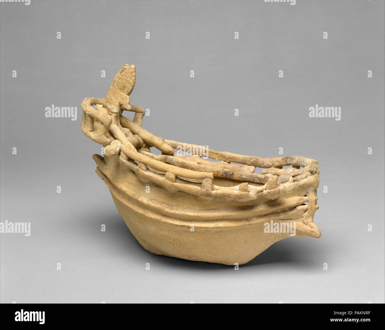 Terracotta model of a ship. Culture: Cypriot. Dimensions: H. 7 in. (17.8 cm). Date: ca. 600-480 B.C..  The model depicts, in considerable detail, the features of a contemporary vessel. It includes the helmsman sitting in the bow. All of the preserved ship models come from Amathus, indicating the importance of the site as a maritime center. Museum: Metropolitan Museum of Art, New York, USA. Stock Photo