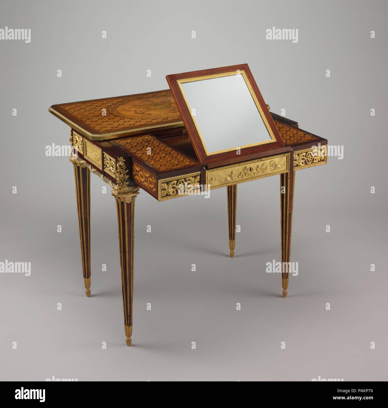 Mechanical table. Culture: French, Paris. Dimensions: Overall: 28 1/2 × 30  3/4 × 19 in. (72.4 × 78.1 × 48.3 cm). Maker: Jean Henri Riesener (French,  Gladbeck, North Rhine-Westphalia 1734-1806 Paris). Date: