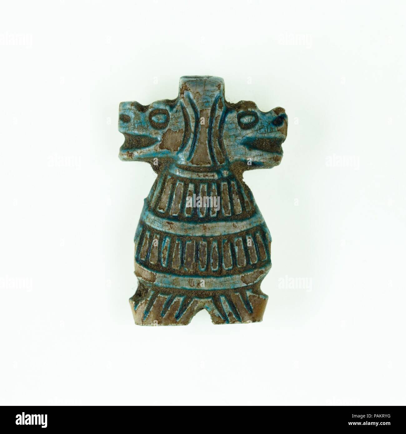 Taweret amulet with double head. Dimensions: H. 2 cm (13/16 in.); W. 1.4 cm (9/16 in.); D. 0.4 cm (3/16 in.). Dynasty: Dynasty 18, late-Dynasty 19. Date: ca. 1390-1213 B.C..  Double-headed  amulets of the domestic goddess Taweret are rare forms and date to the 18th dynasty,. Amarna is among the known findspots for these, although this particular example is without provenance. Museum: Metropolitan Museum of Art, New York, USA. Stock Photo