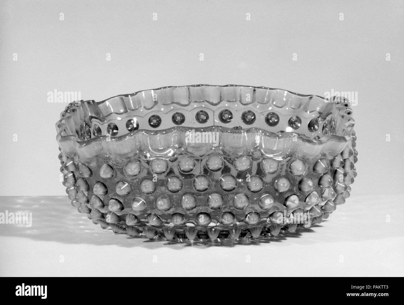Hobnail Fruit Bowl. Culture: American. Dimensions: 3 3/16 x 8 in. (8.1 x 20.3 cm). Maker: Probably Hobbs, Brockunier and Company (1863-1891). Date: after 1886. Museum: Metropolitan Museum of Art, New York, USA. Stock Photo