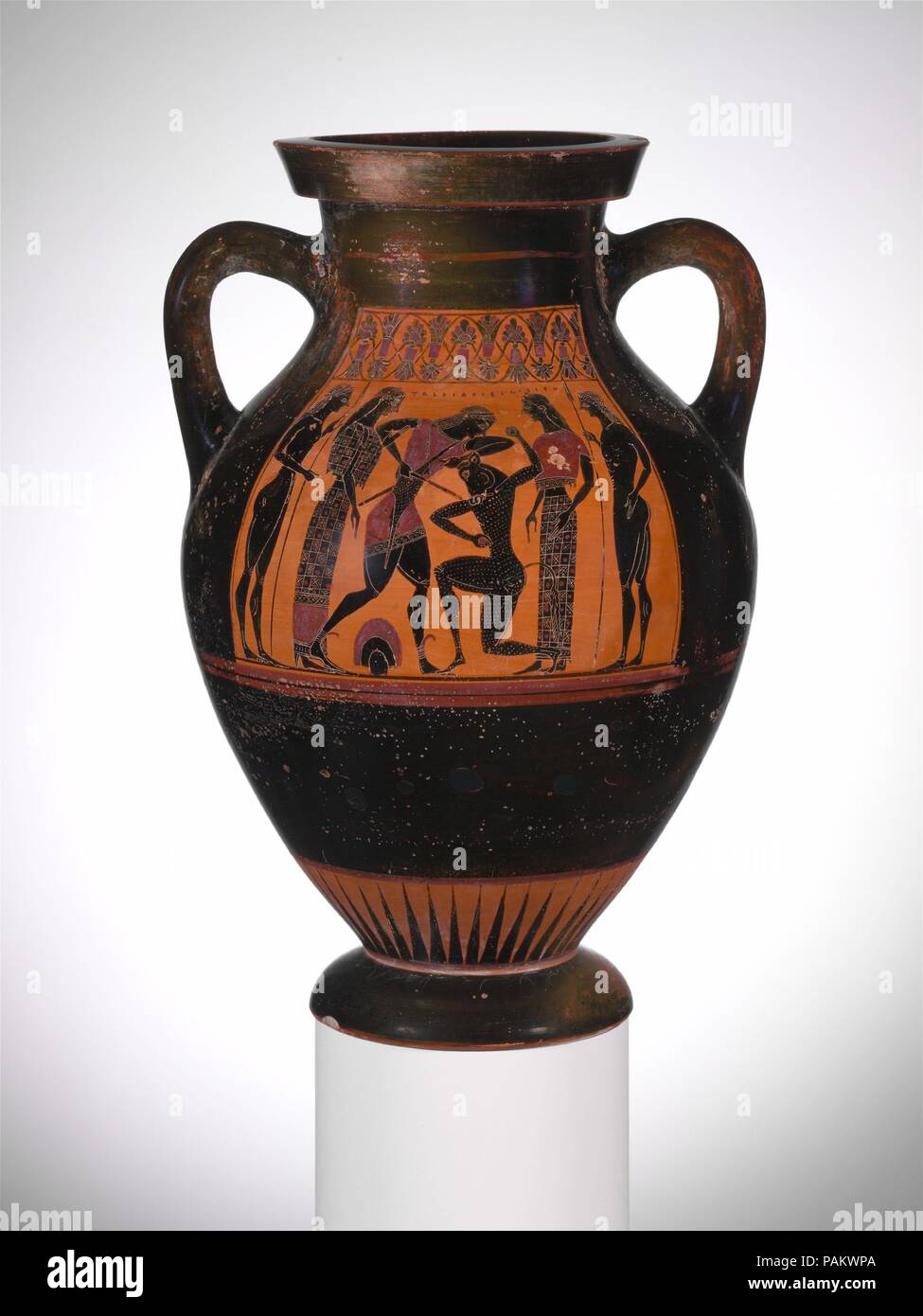 Terracotta amphora (jar). Culture: Greek, Attic. Dimensions: H. 11 5/8 in. (29.5 cm). Date: ca. 540-530 B.C..  Obverse, Theseus slaying the Minotaur  Reverse, men weighing merchandise  Discovered at Agrigento in Sicily before 1801, this may be the first Greek vase with a potter's signature to have been published in modern Europe. Besides the signature, there is an inscription praising a youth, Klitarchos, as handsome. After Herakles, Theseus is the major hero in Athenian iconography. He was credited with uniting the principalities of Attica and with numerous exploits. Here he kills the Minotau Stock Photo
