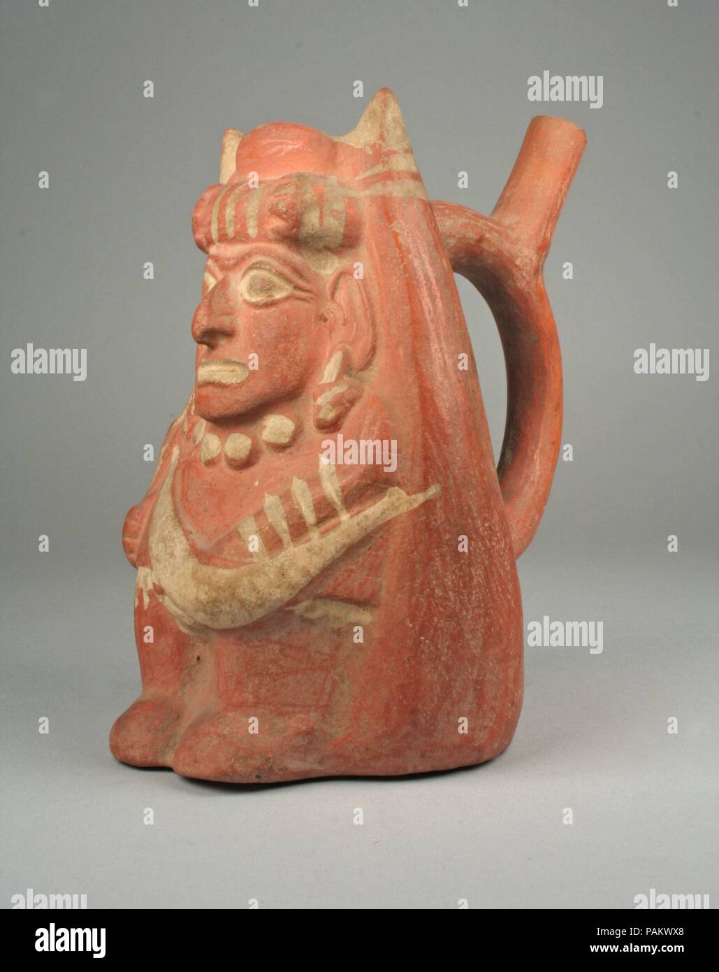 Stirrup Spout Bottle with Figure. Culture: Moche. Dimensions: H. 7 3/8 x W. 5 3/16 in. (18.7 x 13.2 cm). Date: 4th-6th century. Museum: Metropolitan Museum of Art, New York, USA. Stock Photo