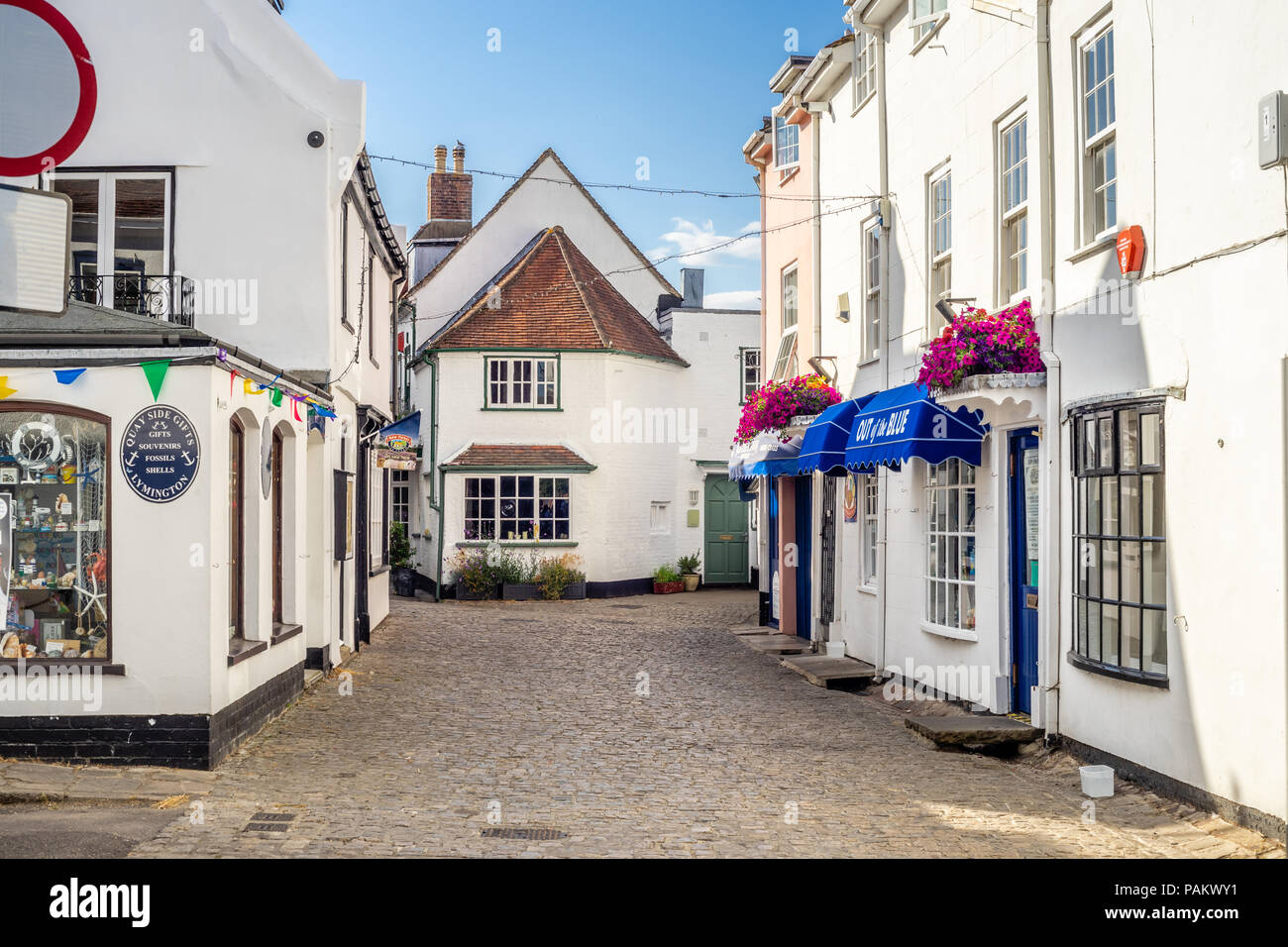 Street view with white buildings along Quay Hill in Lymington, Hampshire, England, UK Stock Photo