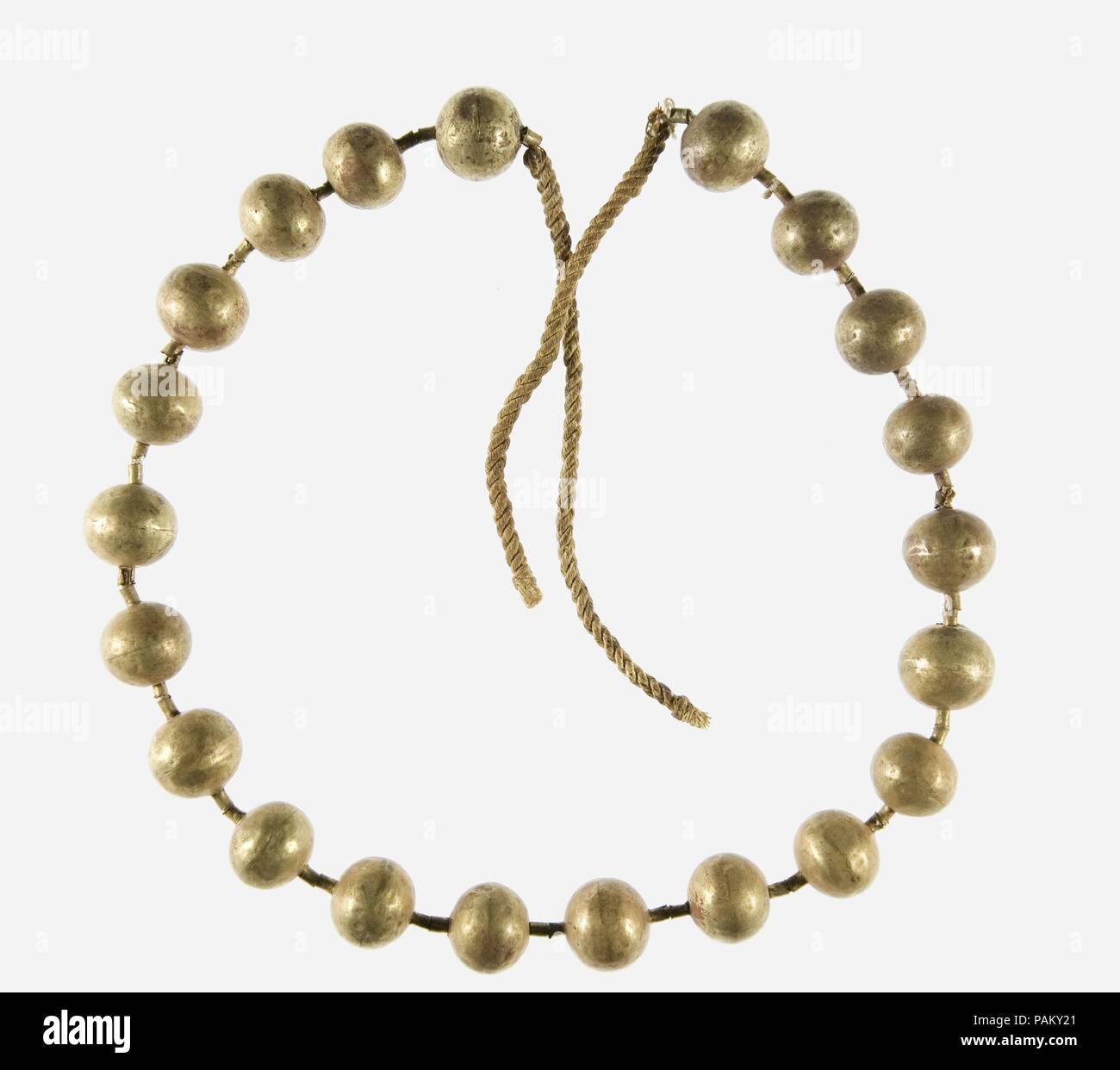 Gold Necklace of the Child Myt. Dimensions: L. 61 cm (24 in). Dynasty: Dynasty 11. Reign: reign of Mentuhotep II, early. Date: ca. 2051-2030 B.C..  Myt's mummy was wrapped in several layers of sheets, and five necklaces (22.3.320-.324) were found between the layers around her head. The precious material and fine quality of her jewelry indicate that she must have been of high status, even though she was just a little girl five years old. It has been speculated that she was a daughter of Mentuhotep II, but there is no direct evidence for that. Museum: Metropolitan Museum of Art, New York, USA. Stock Photo