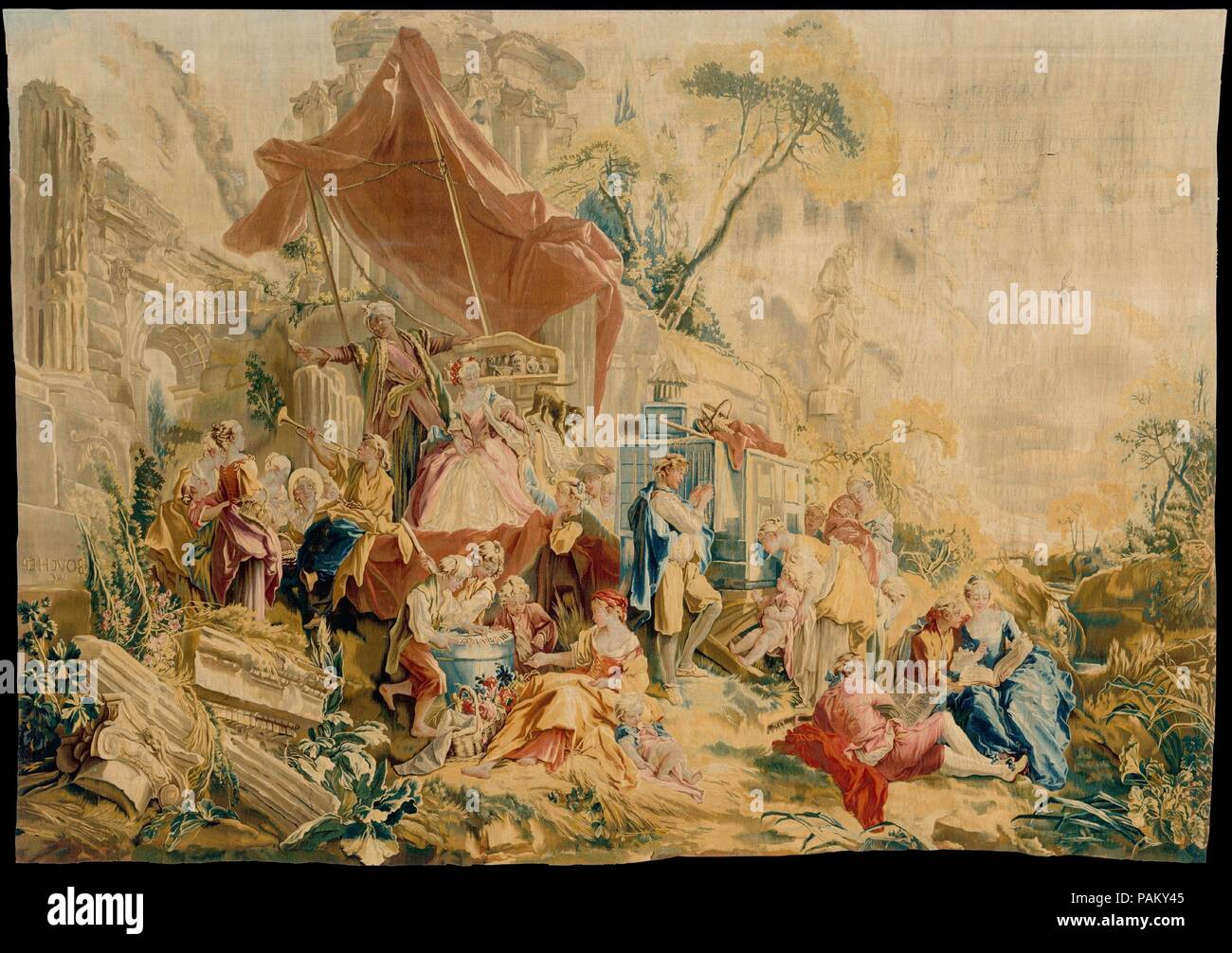 The Charlatan and the Peep Show from a set of the Italian Village Scenes. Culture: French, Beauvais. Designer: Designed by François Boucher (French, Paris 1703-1770 Paris). Dimensions: 111 1/2 × 160 1/2 in. (283.2 × 407.7 cm). Manufactory: Beauvais. Patron: Commissioned for Boulard de Gatellier (Château de Gatellier (Loire)). Workshop director: André Charlemagne Charron (French, active 1754-80). Date: designed 1734-36, woven 1762.  Images of gardens were popular in the tapestry medium from the medieval era, where the so-called mille-fleurs (thousand flowers) (see also 2013.506) provided a deco Stock Photo