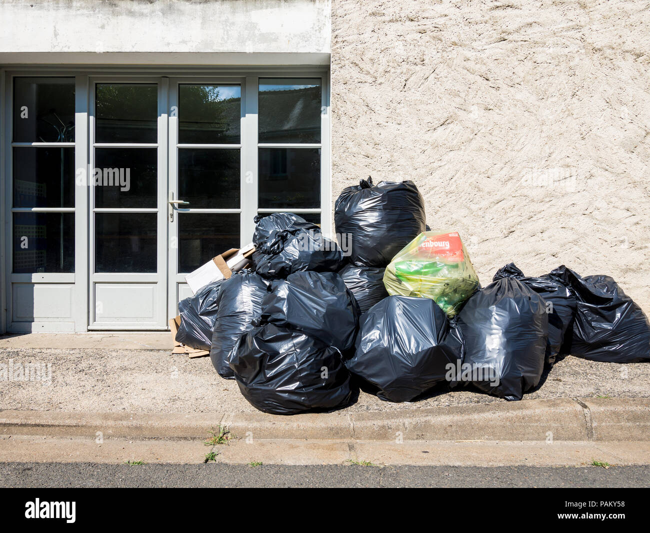 Black bin bags awaiting collection, Abilly, Indre-et-Loire, France. Stock Photo