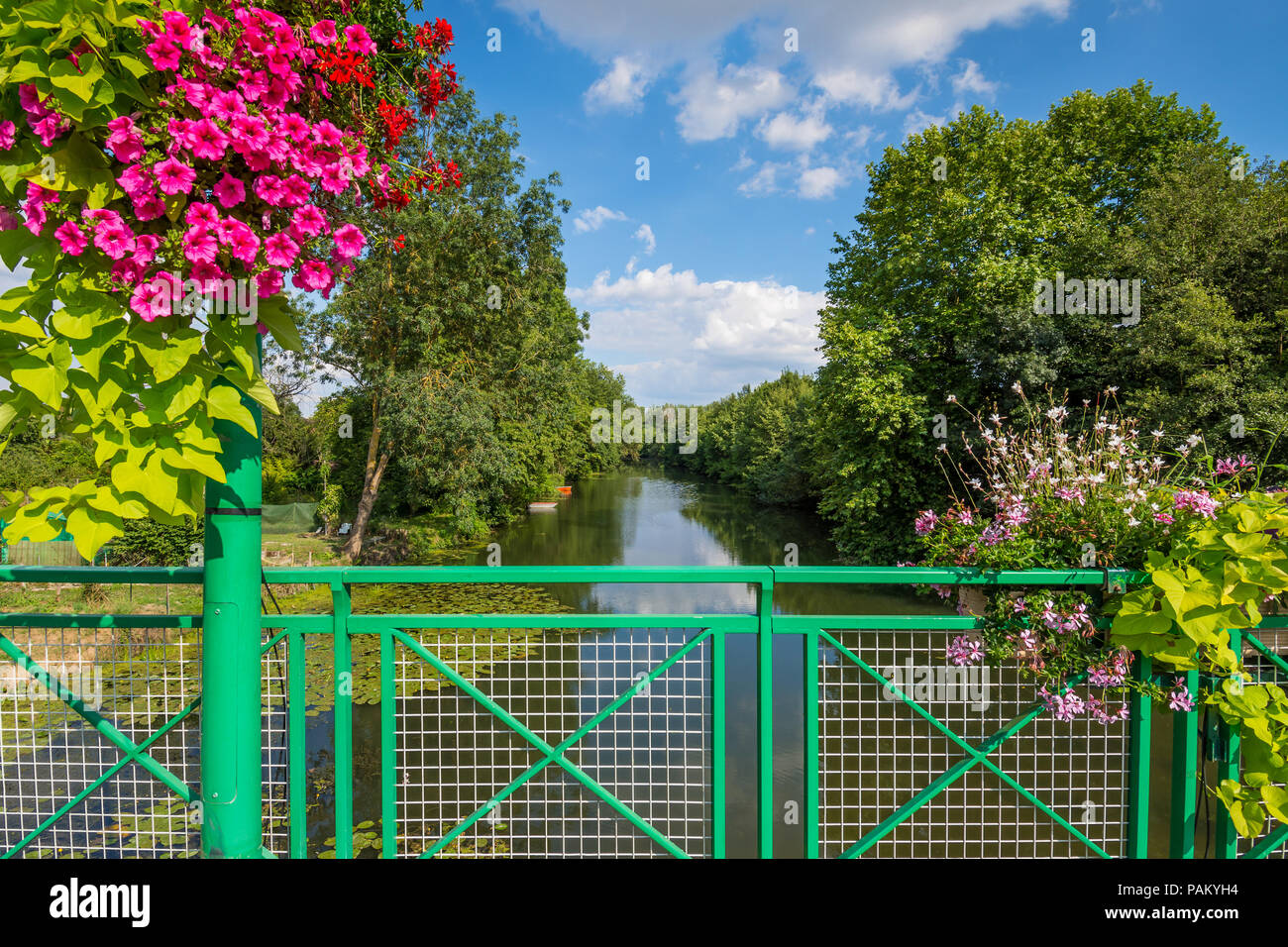 Railing and flower display on bridge across river Claise, Abilly, Indre-et-Loire, France. Stock Photo
