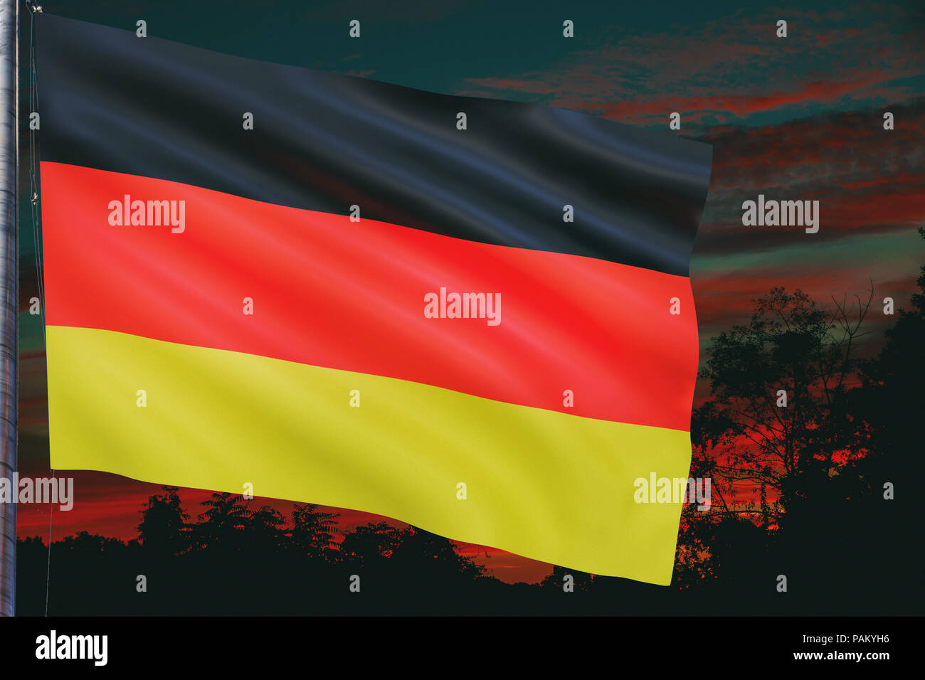 German national flag waving during the evening with sunset Stock Photo