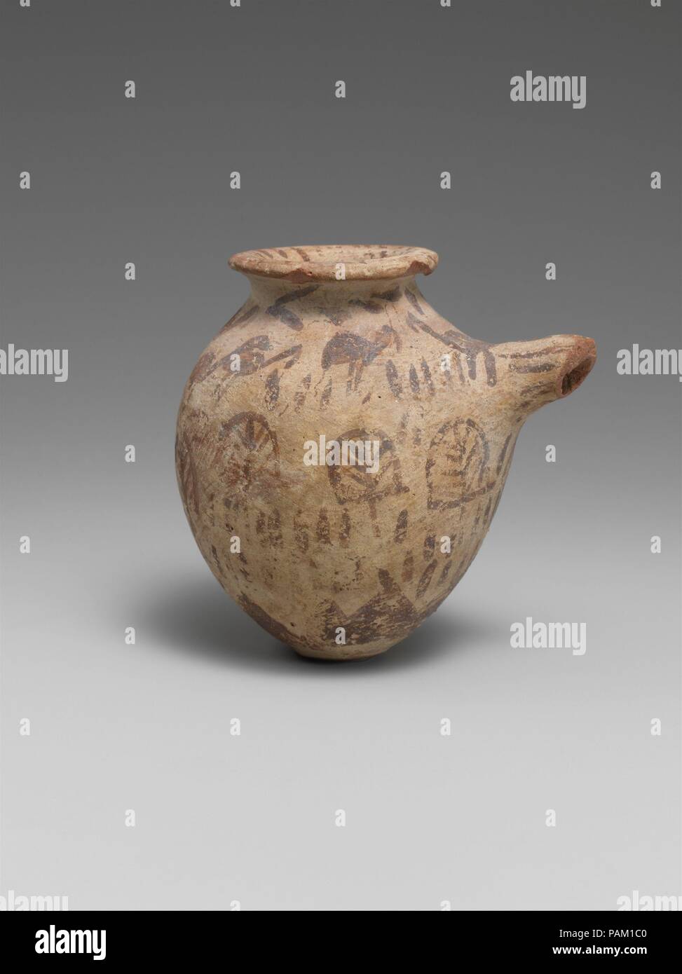 Spouted vessel in decorated ware. Dimensions: H. 8 × Diam. 8.2 cm (3 1/8 × 3 1/4 in.). Date: ca. 3500 B.C.. Museum: Metropolitan Museum of Art, New York, USA. Stock Photo