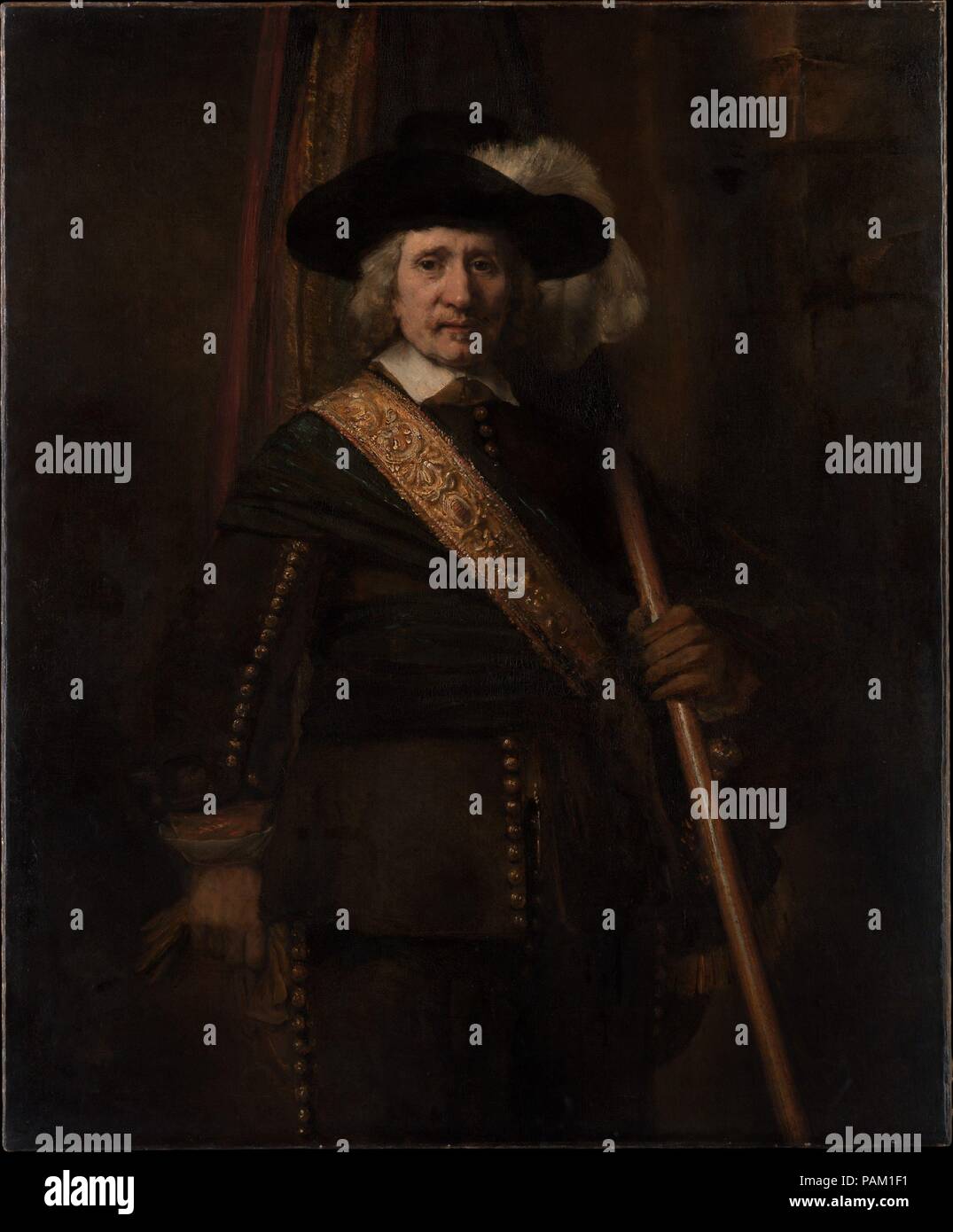 The Standard Bearer (Floris Soop, 1604-1657). Artist: Rembrandt (Rembrandt van Rijn) (Dutch, Leiden 1606-1669 Amsterdam). Dimensions: 55 1/4 x 45 1/4in. (140.3 x 114.9cm). Date: 1654.  The flag, the plume in the hat, and the tooled leather baldric (sword-belt) indicate that the figure is an ensign in one of Amsterdam's civic guard companies. He is almost certainly Floris Soop, a wealthy bachelor whose estate included 140 paintings. Rembrandt conveys a strong sense of character and reveals extraordinary skill in the vigorously modeled face, the thick hair, and costume details. The impressions o Stock Photo
