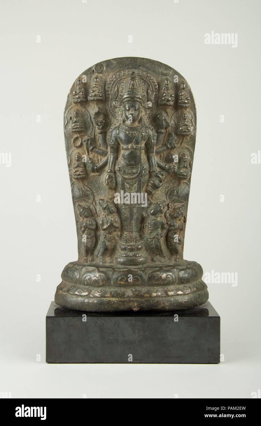 Candi Jago Plaque of the Bodhisattva Amoghapasa. Culture: Indonesia (East Java). Dimensions: H. 8 3/4 in. (22.2 cm); W. 5 1/2 in. (14 cm); D. 1 5/8 in. (4.1 cm); Wt. (with block) 7.5 lbs (3.4 kg). Date: late 13th century, probably 1286-92.  This is one of a number of miniature versions of a large-scale cult icon depicting the Buddhist savior, the Bodhisattva Amoghapasa, in eight-armed form. The style, iconography, and dedicatory inscription on the reverse link this plaque to stone steles from Candi Jago, a late thirteenth-century royal foundation temple, in East Java. The parent icon is dated  Stock Photo