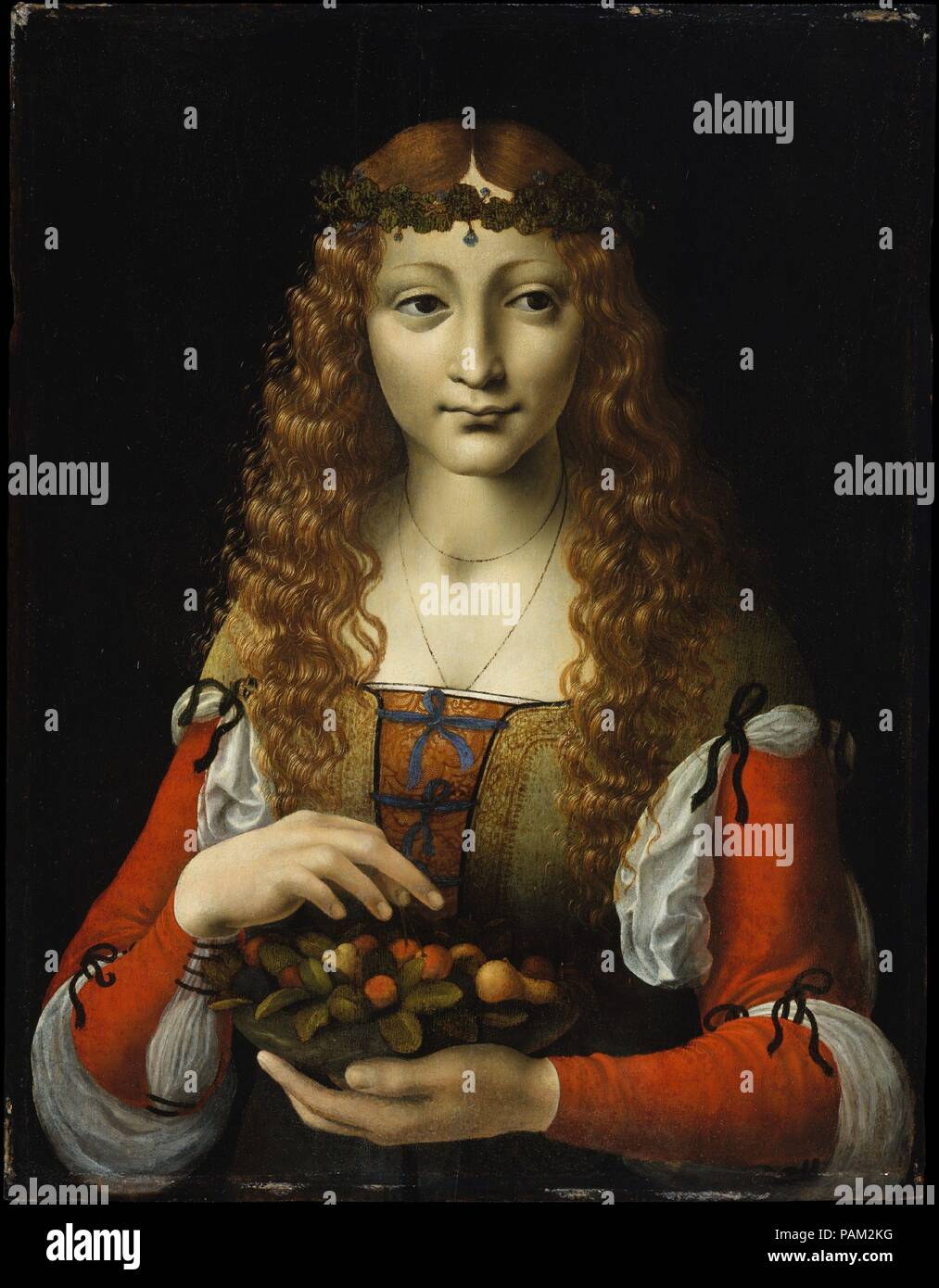 Girl with Cherries. Artist: Attributed to Giovanni Ambrogio de Predis (Italian, Milanese, active by 1472-died after 1508). Dimensions: 19 1/4 x 14 3/4 in. (48.9 x 37.5 cm). Date: ca. 1491-95.  Trained in Milan, Ambrogio de Predis was associated after 1483 with Leonardo da Vinci, with whom he collaborated. The careful study of the positions of the hands and the enigmatic, slight smile both come from Leonardo's example. The painting is sometimes thought to be by another of his followers, such as Giovanni Antonio Boltraffio. The lady wears a wreath of ground ivy, suggesting her connection with hu Stock Photo