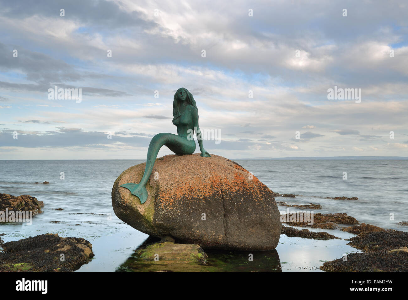 Pretty Mermaids On Rock
