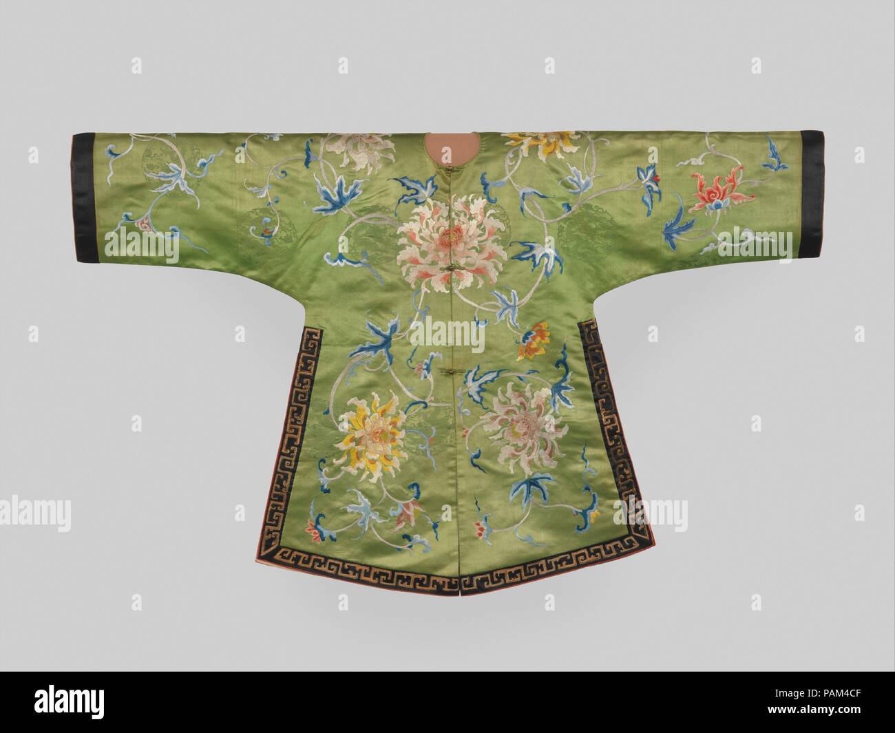 Jacket for a Theatrical Costume. Culture: China. Dimensions: 30 1/2 x 51 1/2 in. (77.5 x 130.8 cm). Date: 18th century.  Three of these exquisite jackets are known to exist: two are in the collection of the Metropolitan Museum and a third is in the Qing court collection of theatrical costumes of the Palace Museum, Beijing. All three have the same delicate floral pattern and identical seals and inscriptions on their linings.   The jackets were made in the textile bureau in Suzhou as tribute objects for the imperial court. They were part of an ensemble, perhaps with a skirt or other garment, and Stock Photo