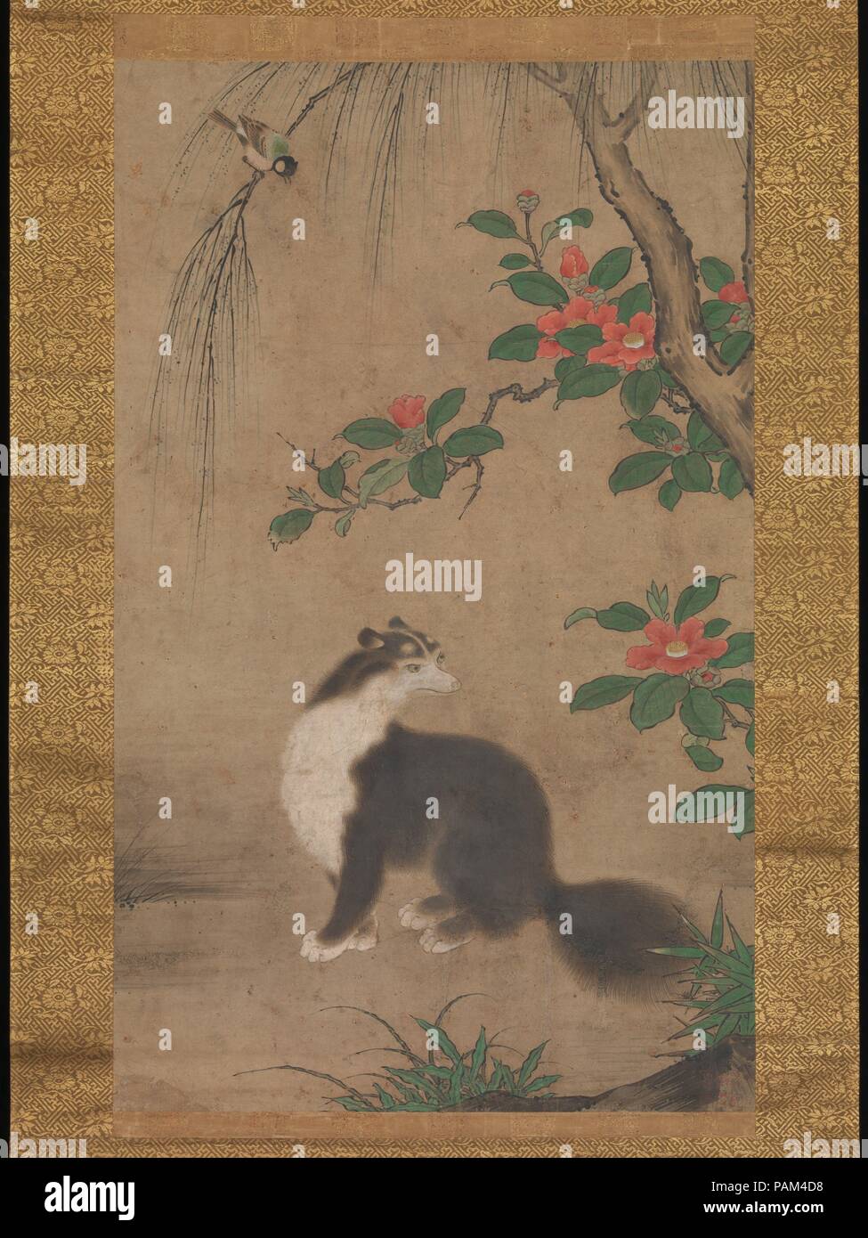Musk Cat. Artist: Uto Gyoshi (Japanese, active second half of 16th century). Culture: Japan. Dimensions: Image: 29 15/16 × 18 5/16 in. (76 × 46.5 cm)  Overall with mounting: 66 1/8 × 24 1/8 in. (168 × 61.3 cm)  Overall with knobs: 66 1/8 × 25 7/8 in. (168 × 65.8 cm). Date: second half of the 16th century.  A fluffy black-and-white musk cat does its best to ignore the agitated titmouse on a willow branch above him. Although not native to Japan, musk cats (jakoneko), or civets, served as an auspicious motif associated with longevity. These nocturnal, cat-like mammals with long pointed snouts wer Stock Photo