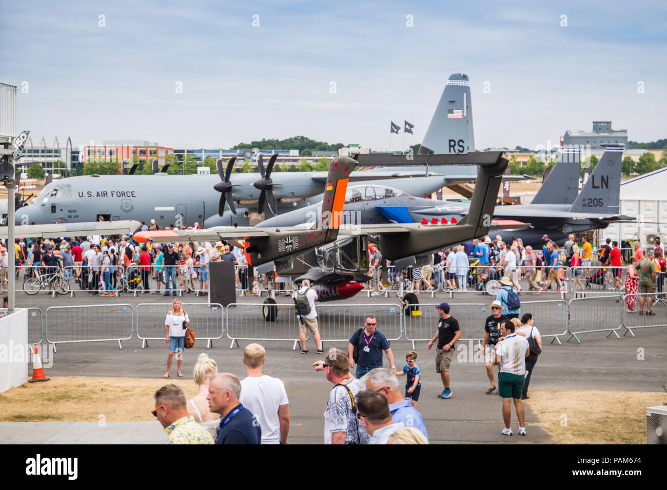 Visitors looking at C-130 Hercules and other air force plane in Farnborough Airshow 2018 in Farnborough, hampshire, United kingdom. Stock Photo