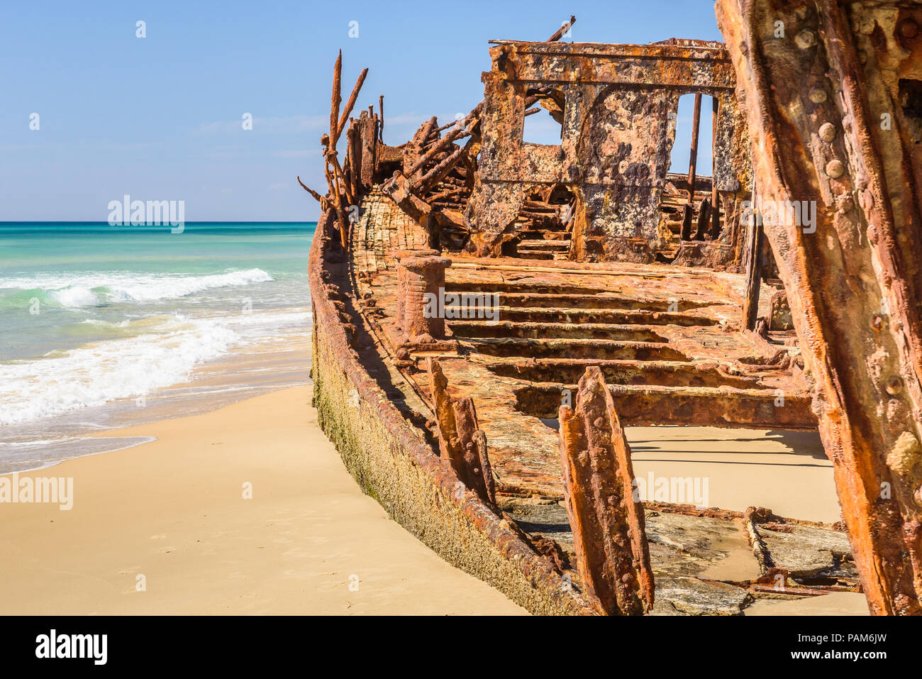 Close up of the Maheno shipwreck on the beach of Fraser Island, Queensland, Australia, with no people and clear blue sky Stock Photo