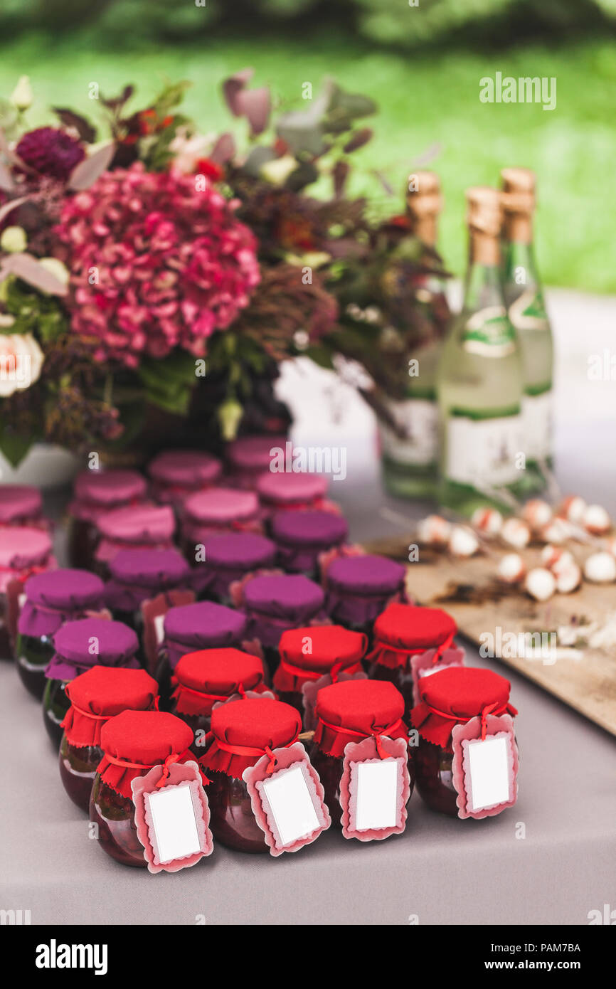 Many Craft Colorful Jars With Homemade Jam On Wedding Reception