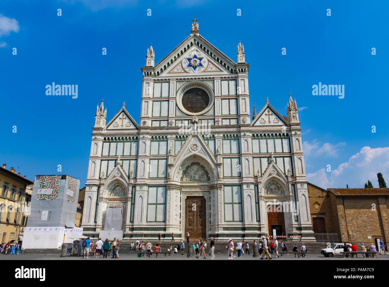 FLORENCE, ITALY - May 23, 2011: external view of Basilica Santa Croce in Florence, unidentified people admiring the facade from Piazza Santa Croce in  Stock Photo
