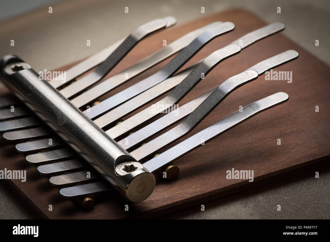 Details of a small thumb piano with silver tines, brown wood Stock ...