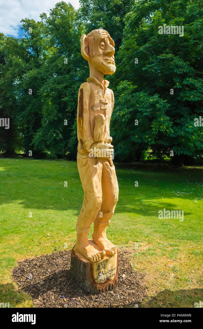 A chain saw wooden sculpture of the BFG Big Friendly Giant in the grounds of the Bowes Museum accompanying an exhibition of drawings of the character Stock Photo