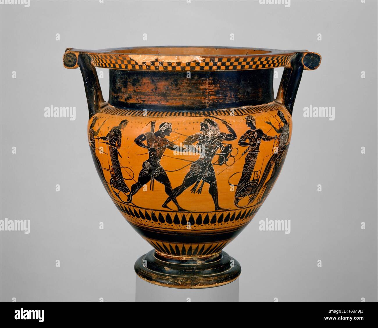 Terracotta column-krater (bowl for mixing wine and water). Culture: Greek, Attic. Dimensions: H. 13 in. (33 cm)  diameter  14 1/2 in. (36.8 cm). Date: ca. 520-510 B.C..  Within the mouth, ships and dolphins  On the body, obverse, the struggle between Herakles and Apollo for the Delphic tripod; reverse, onlookers  Representations of Herakles' attempt to seize the tripod from the oracle of Apollo at Delphi were popular in Attic vase-painting from the end of the sixth century B.C. to the mid-fifth. In addition to featuring the local hero, Herakles, they afforded artists the opportunity to depict  Stock Photo
