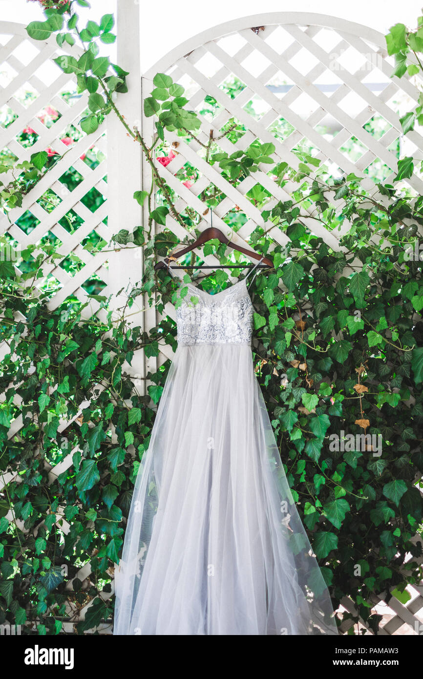 Details of a gray fashionable silk wedding dress embroidered with lace
