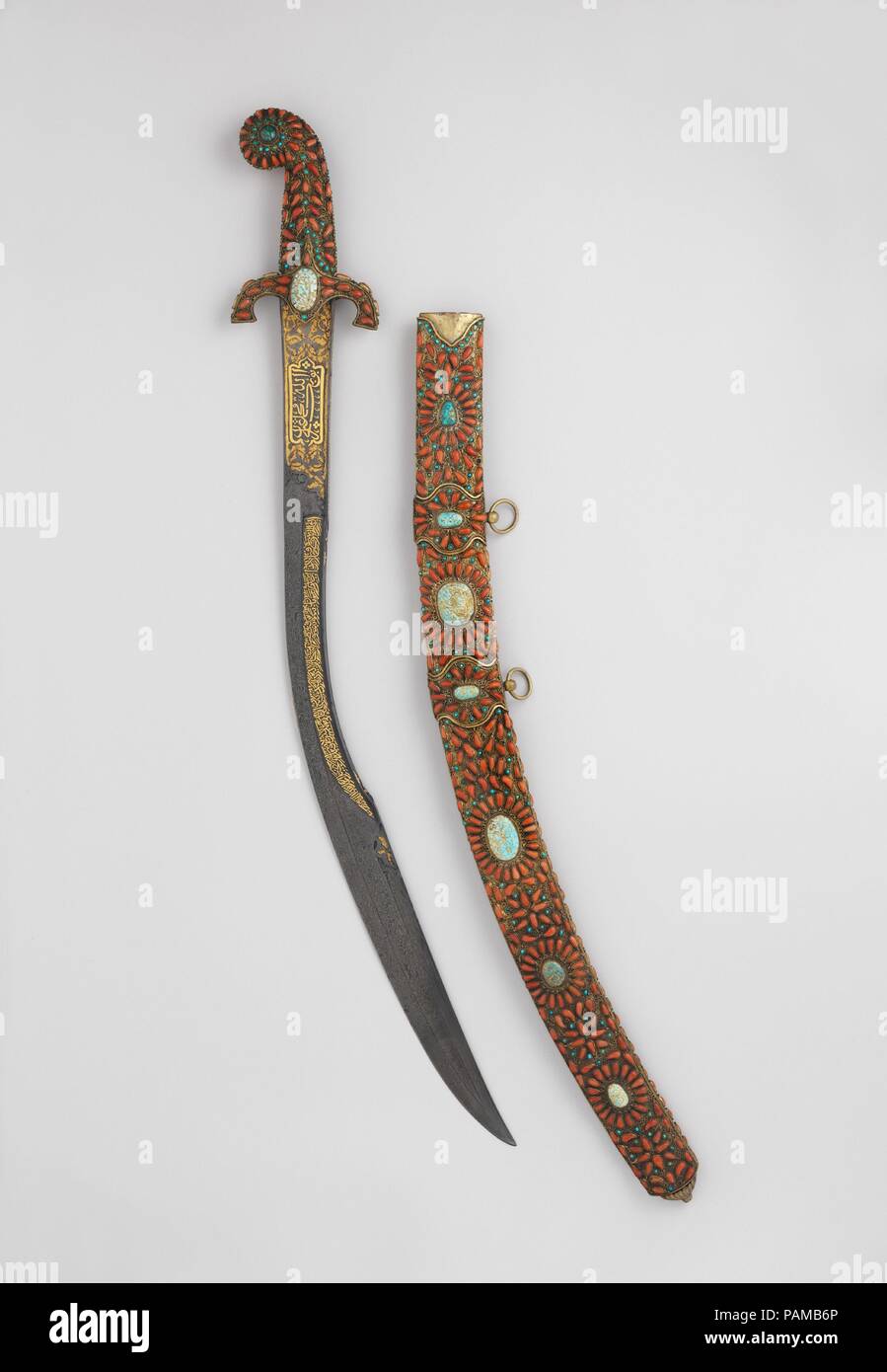 Sword (Kilij) with Scabbard. Culture: Turkish. Dimensions: L. 35 1/2 in. (90.2 cm). Date: 19th century.  The inscriptions on the sword invoke Allah, the Prophet Muhammad, and 'Ali. The stones adorning the hilt and scabbard of the sword have talismanic significance. According to scholar Al-Biruni's eleventh-century manuscript <i>Kitab al- Jamahir</i> (Book of Precious Stones), coral was believed to prevent misfortune and turquoise to avert the evil eye. Museum: Metropolitan Museum of Art, New York, USA. Stock Photo