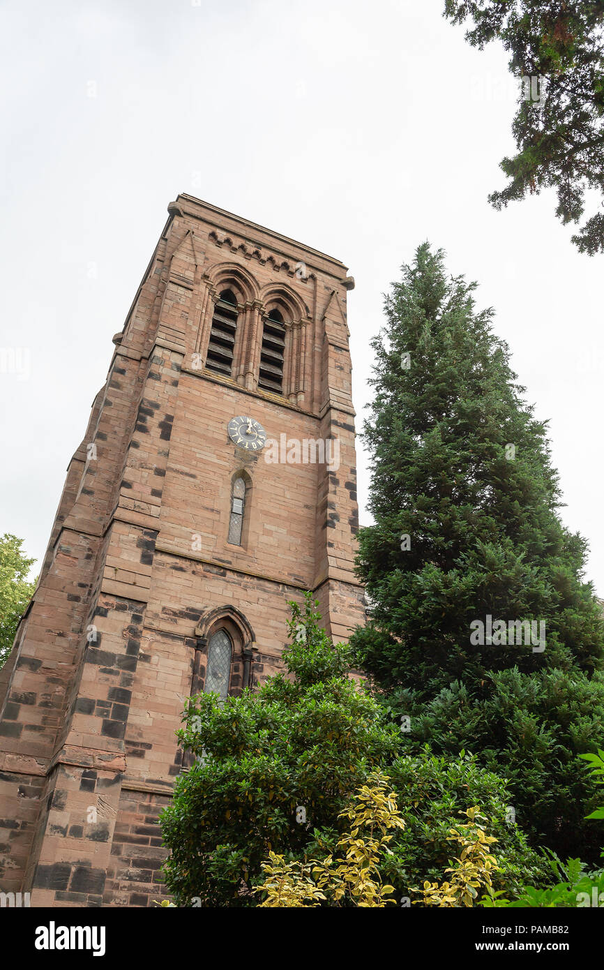 Tower of St Matthew's Church in Stretton, Cheshire, where the clock face shows the words 'TIME IS NOT ALL' Stock Photo
