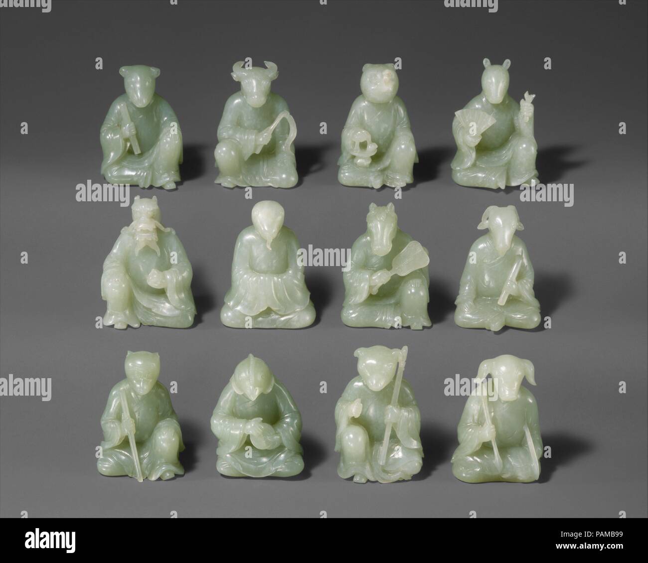 Twelve Animals of the Chinese Zodiac. Culture: China. Dimensions: Overall (each approx.): H. 2 1/4 in. (5.7 cm); W. 1 3/4 in. (4.4 cm). Date: 18th century.  The twelve animals of the Chinese zodiac are popular decorative motifs and have been used in various media. This set, made of flawless pale green jade, must have been particularly prized during the Qing dynasty: two additional identical sets from the imperial collection are known (now in the Palace Museum, Beijing). With extraordinary talent and skill, the master carvers have created a lively group of individual characters with varied post Stock Photo