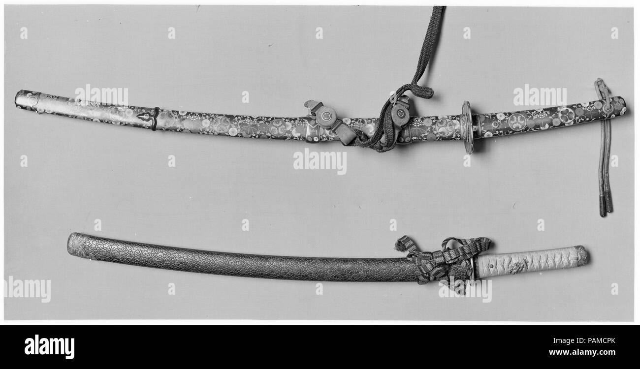 Blade and Mounting for a Slung Sword (Tachi). Culture: Japanese. Dimensions: L. 32 7/8 in. (83. 5 cm); L. of blade 25 15/16 in. (65.8 cm); L. of cutting edge 19 5/8 in. (49.8 cm); D. of curvature 5/16 in. (0.75 cm). Sword maker: Naganori (Japanese, active 13th century). Date: blade, late 13th-early 14th century; mounting, 18th-early 19th century. Museum: Metropolitan Museum of Art, New York, USA. Stock Photo