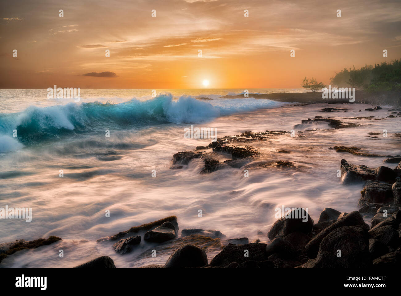 Waves and sunrise. The Puna Coast, Hawaii, The Big Island Stock Photo