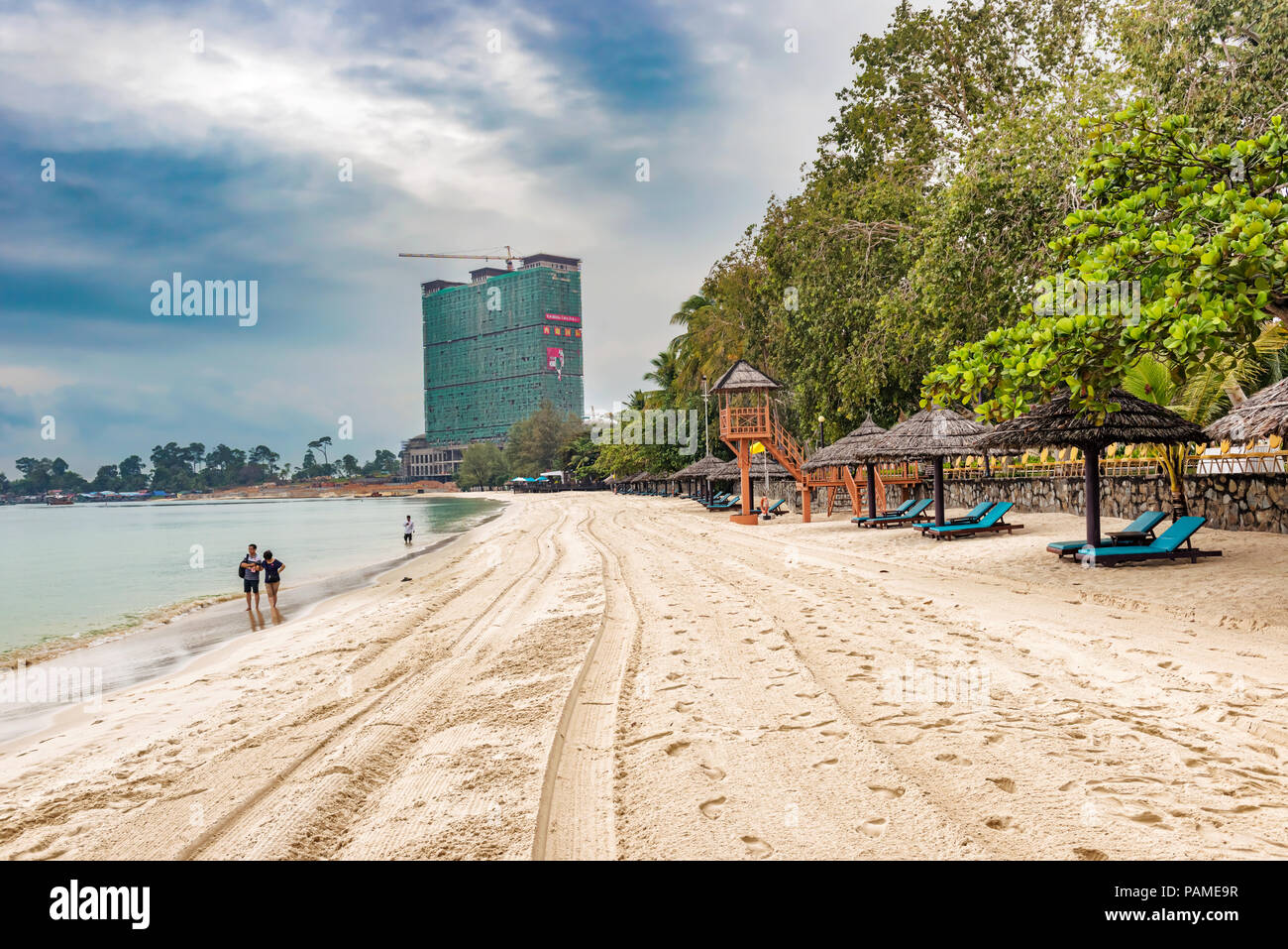 Sihanoukville, Cambodia – Dec 27, 2017: People walking on sandy beach in Sihanoukville. There are many beaches and nearby islands make it premier seas Stock Photo