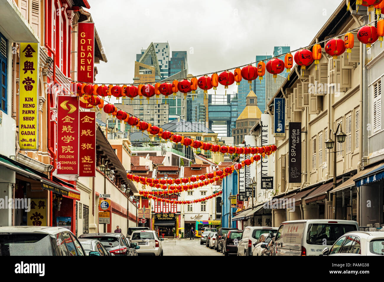 Singapore - January 12, 2018: Traffic at the street with the old colonial houses in the part of Singapore called Chinatown. Stock Photo