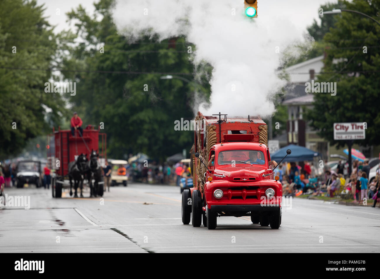 Peru, Indiana, USA July 21, 2018 Old classic red turck creating steam