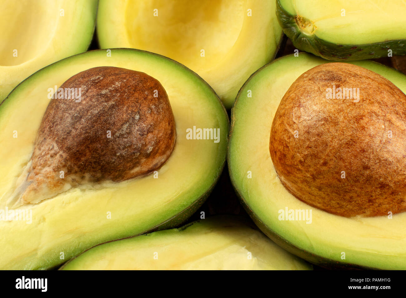 Closeup Photo Of Avocado Cut To Half Brown Seeds Visible With More Avocados In Background Stock Photo Alamy Closeup Photo Of Avocado Cut To Half Brown Seeds Visible With More Avocados In Background Stock Photo Alamy