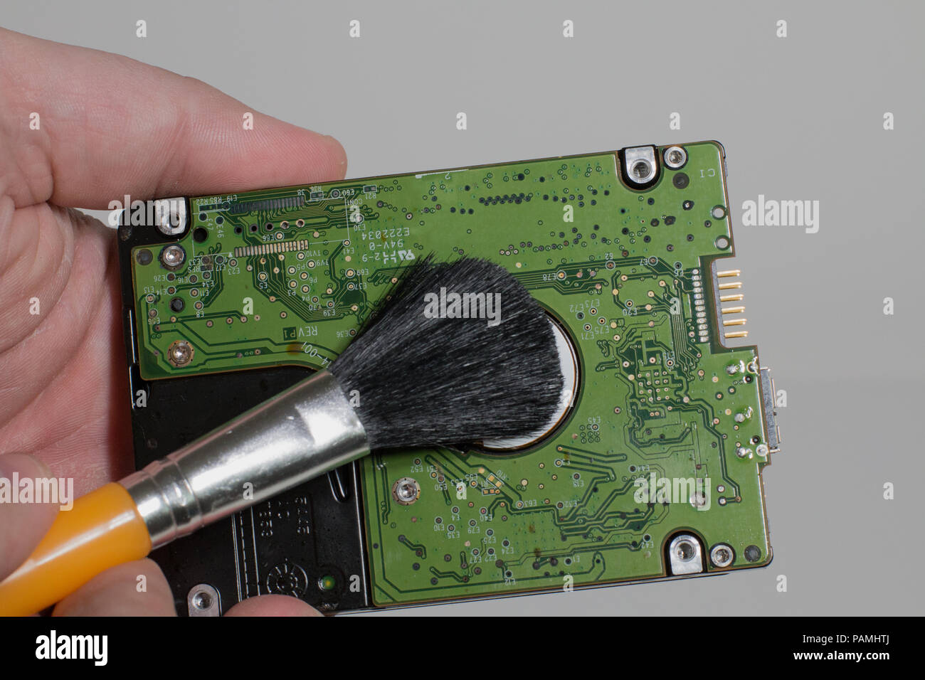 The hard disk is cleaned from dust Stock Photo
