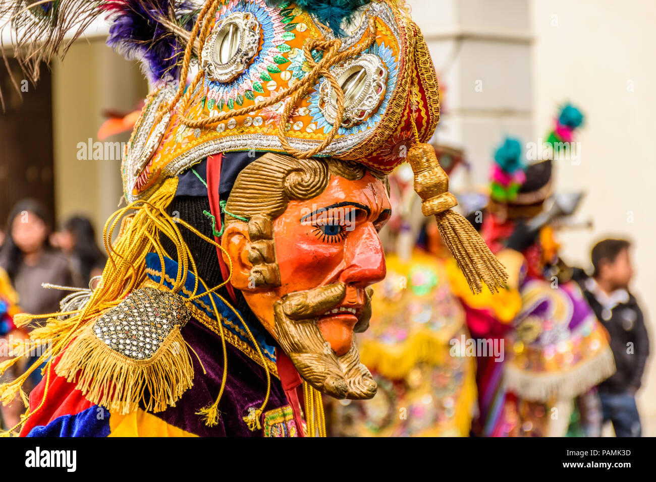 Parramos, Guatemala - December 28, 2016: Traditional folk dancer in mask & costume for Dance of the Moors & Christians near colonial Antigua Stock Photo