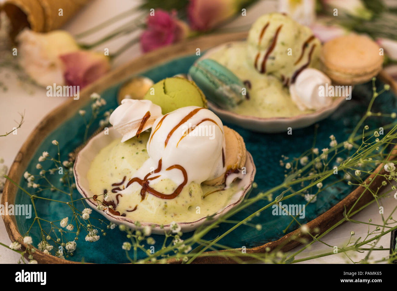 Vanilla and pistachio ice cream served in seashell shaped ceramic