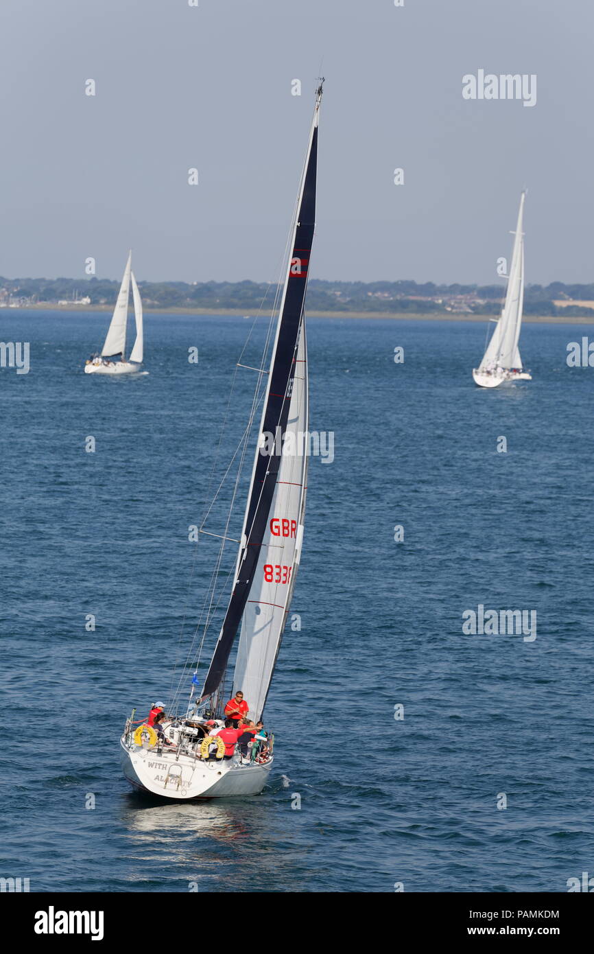 People racing on yachts on the Solent in the Round The Island Race Isle of Wght Hampshire Stock Photo