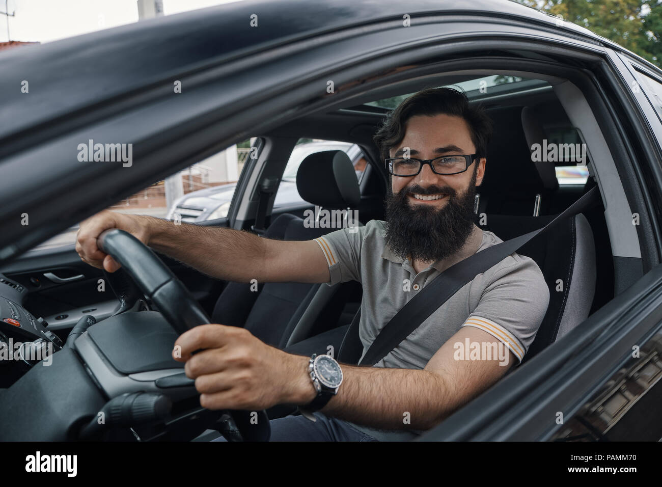 Happy car driver with fastened seat belt Stock Photo - Alamy