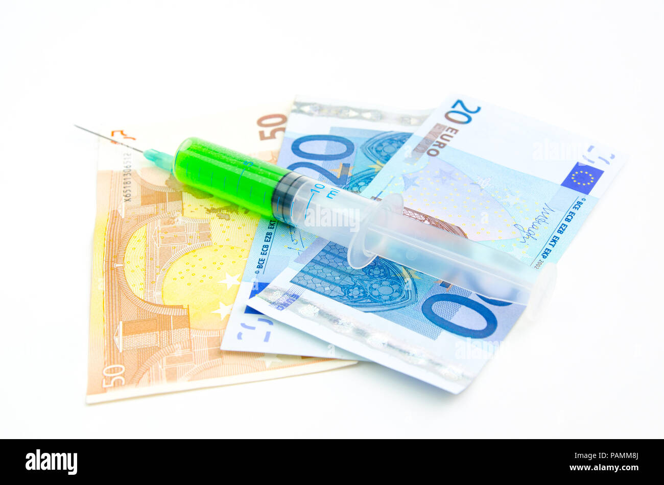 Green cyanide syringe with euro bills Stock Photo
