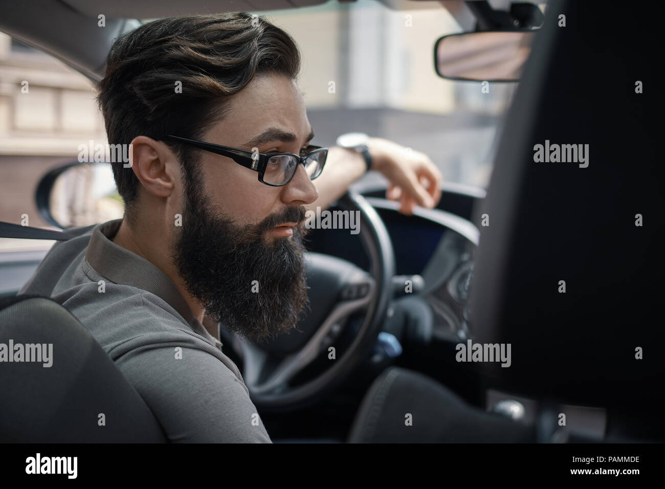 Driver man paying attention to road Stock Photo