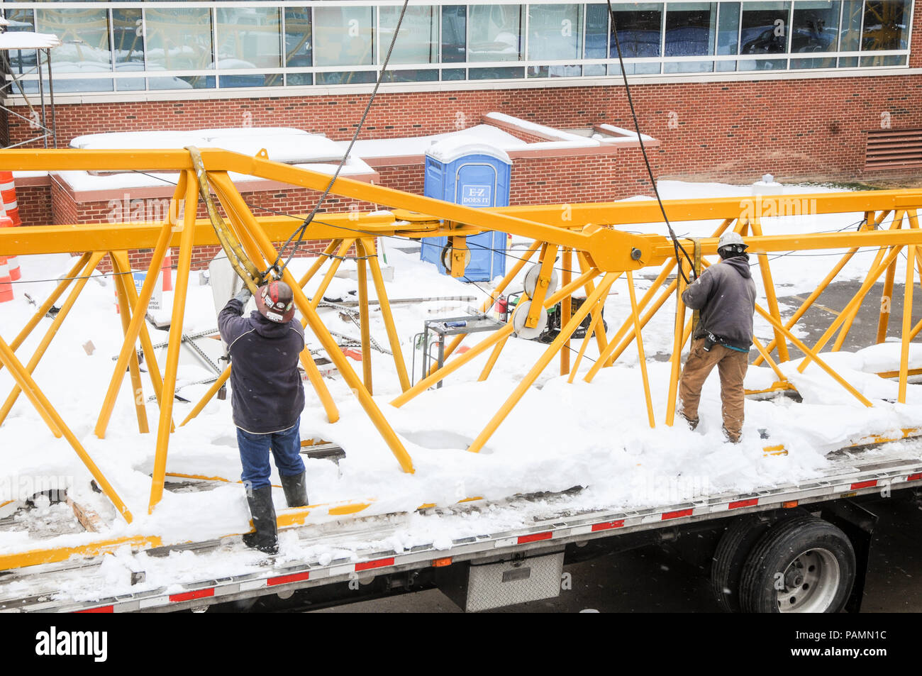 Setting up a tower crane in the winter in Rochester, NY Stock Photo Alamy