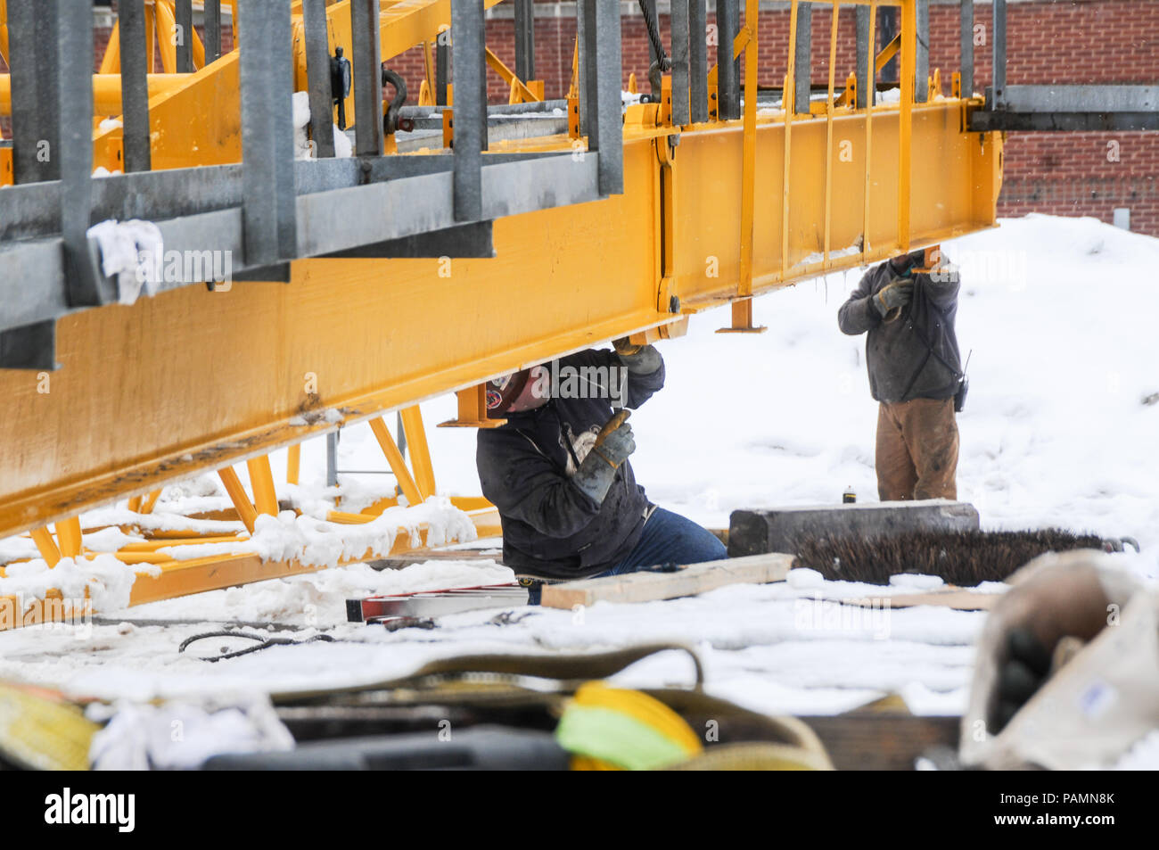 Setting up a tower crane in the winter in Rochester, NY Stock Photo Alamy