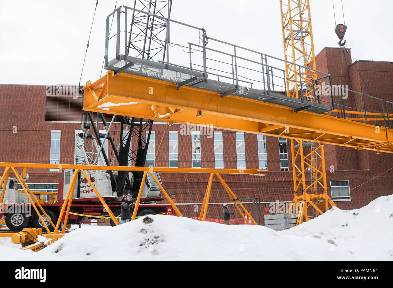Setting up a tower crane in the winter in Rochester, NY Stock Photo Alamy