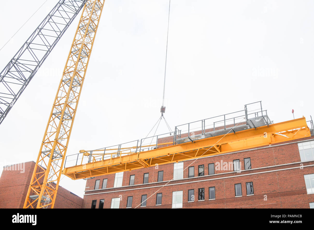 Setting up a tower crane in the winter in Rochester, NY Stock Photo Alamy