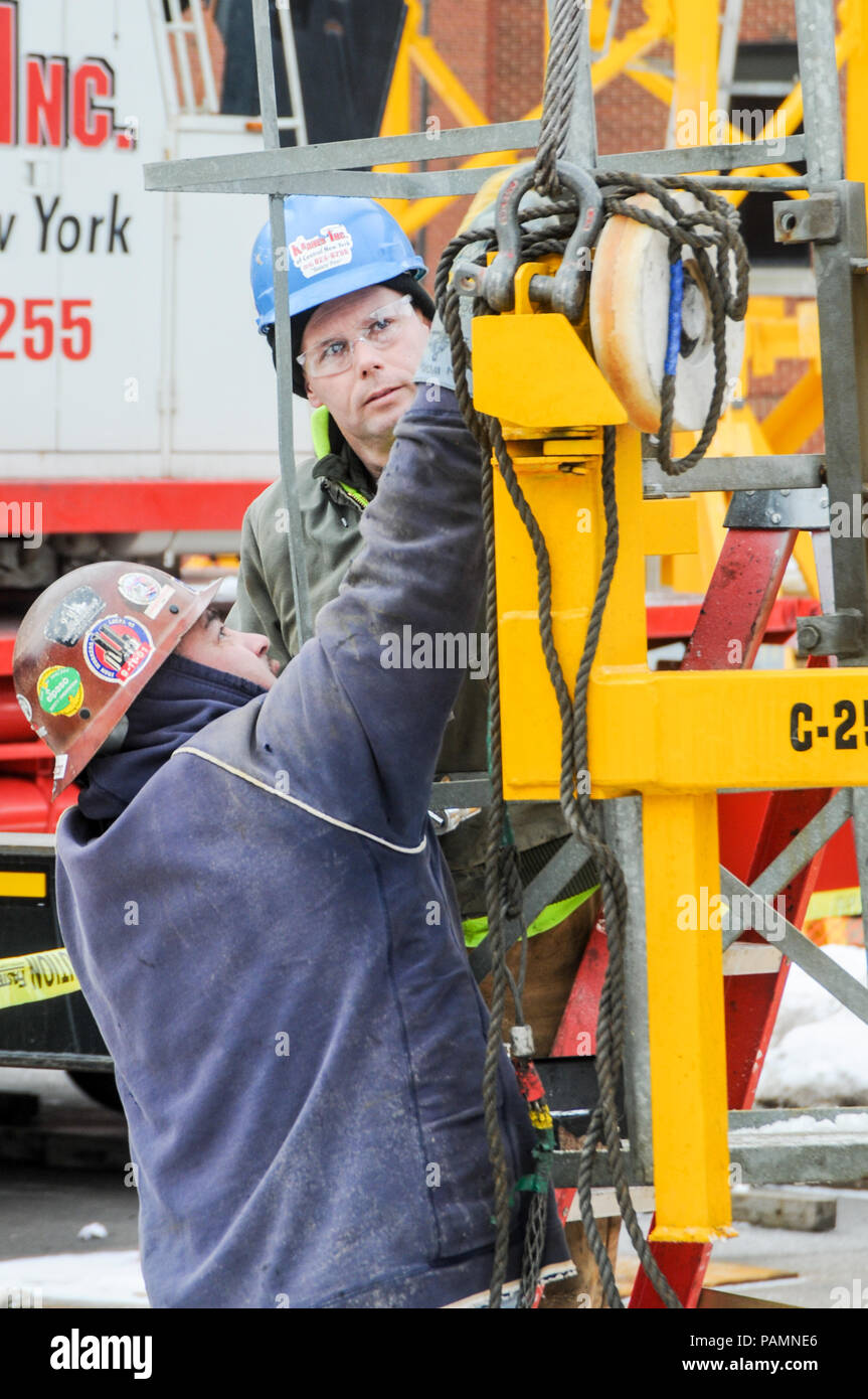 Setting up a tower crane in the winter in Rochester, NY Stock Photo Alamy